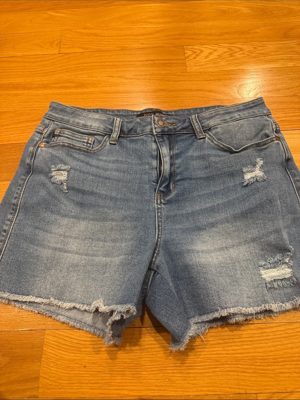 Judy Blue high waisted mild distressed raw hem jeans shorts size large .
